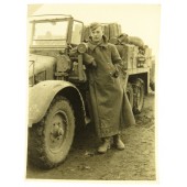 Photo of Wehrmacht driver with his truck "Schnauzer" Krupp- L2H143 (6 х 4) Sd.Kfz 70